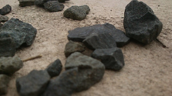 Pile of rocks on sandy ground