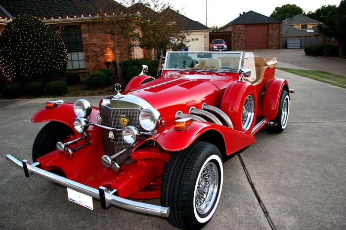 Red Excalibur Phaeton Series II classic convertible car