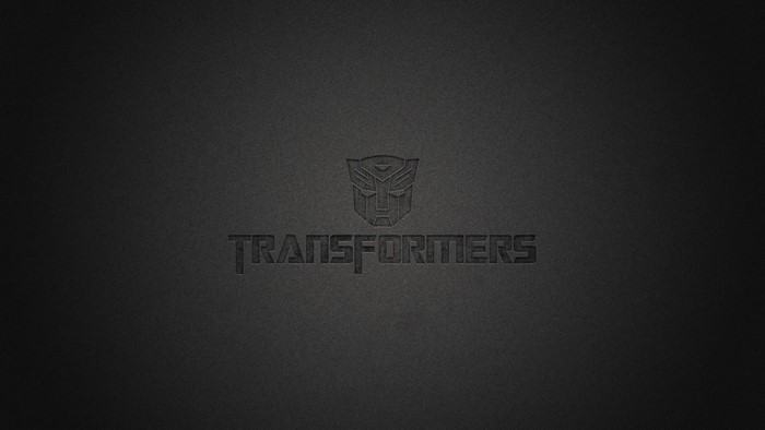 Transformers logo and text on dark background