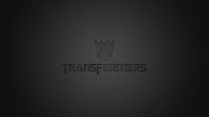 Transformers logo and text on dark background