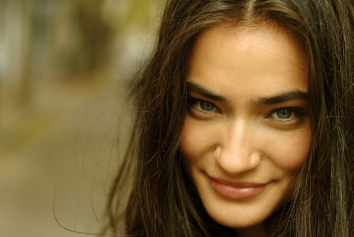 Close-up Portrait of Smiling Woman with Long Hair
