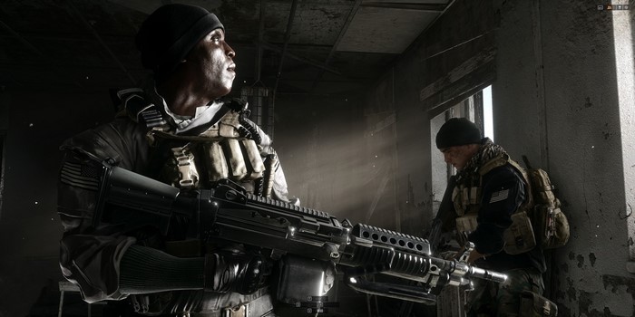 Soldiers with machine guns in a destroyed building