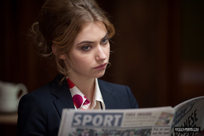Imogen Poots reading a newspaper