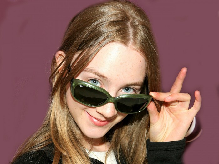 Saoirse Ronan wearing green Ray-Ban sunglasses