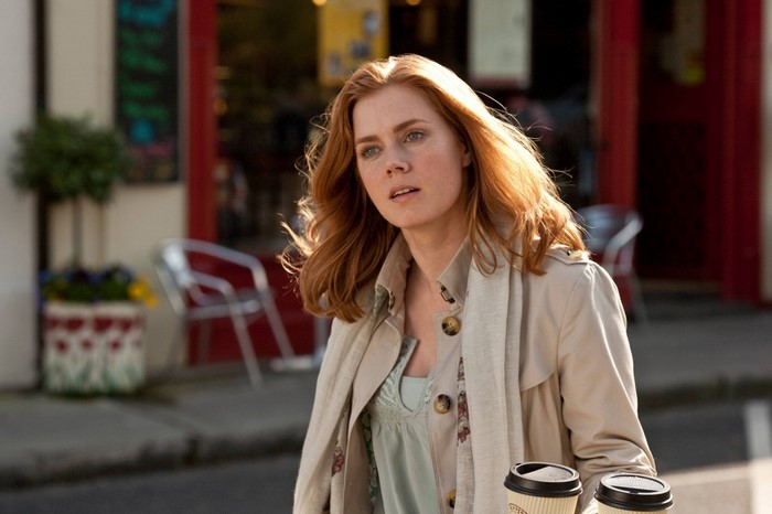 Amy Adams holding coffee cups outdoors