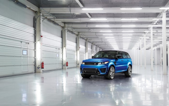 Blue Range Rover Sport in a warehouse