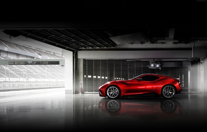 Red Icona Vulcano supercar in a garage