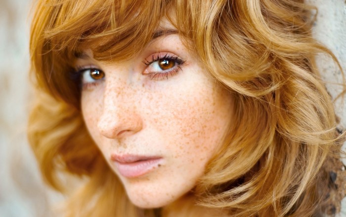 Close-up Portrait of Redhead Woman with Freckles