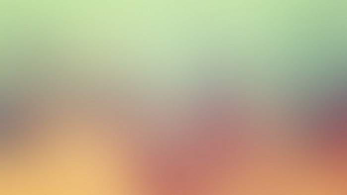 Soft gradient of green, beige, and pink