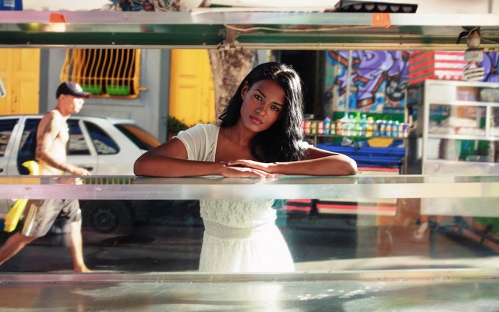 Woman in white dress at a street stall