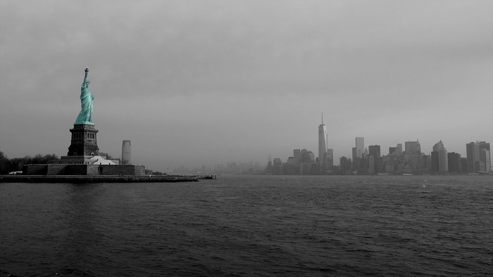Statue of Liberty and New York City skyline on a foggy day
