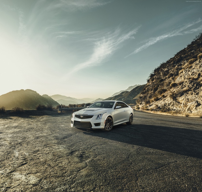 White Cadillac ATS Coupe on a Mountain Road