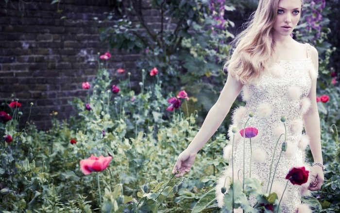 Amanda Seyfried in a garden with poppies