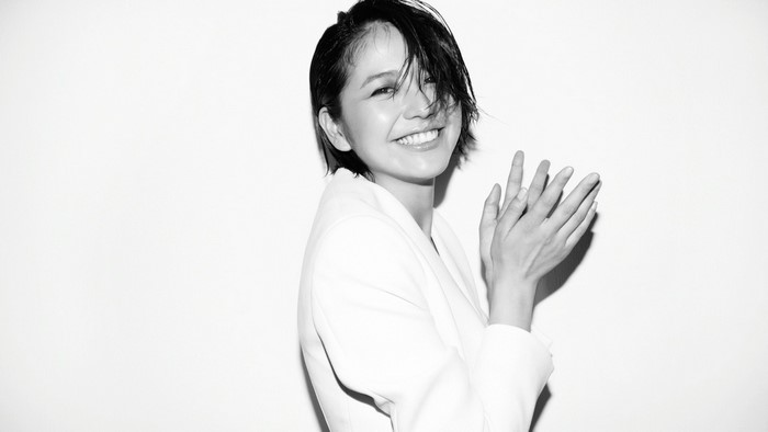 Masami Nagasawa smiling in a white blazer