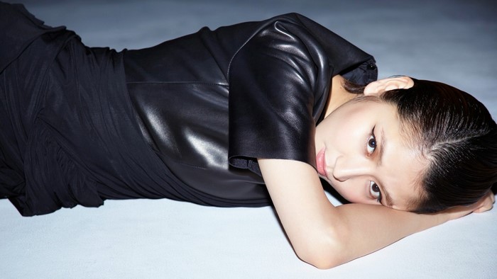 Masami Nagasawa lying down in black clothing