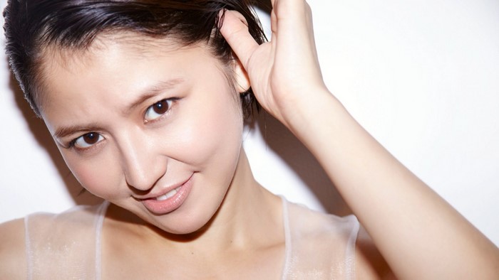Masami Nagasawa portrait with hand in hair