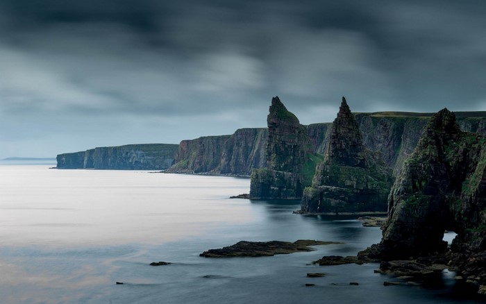 Dramatic cliffs and sea stacks on the coast of Scotland