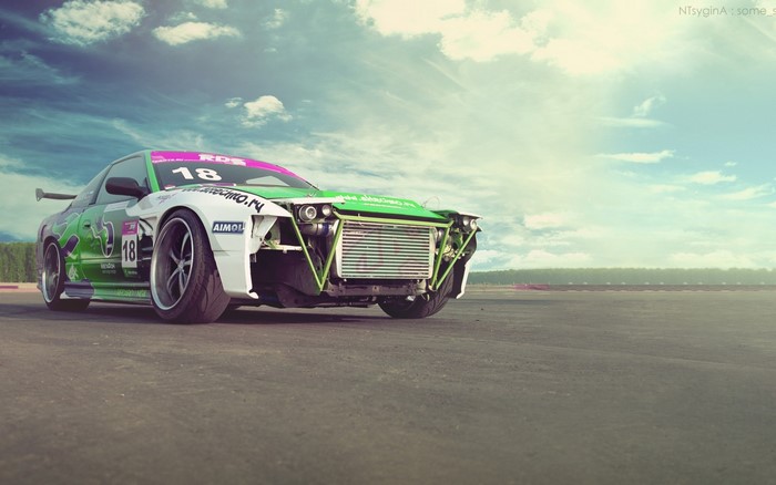 Drift car with number 18 on a race track