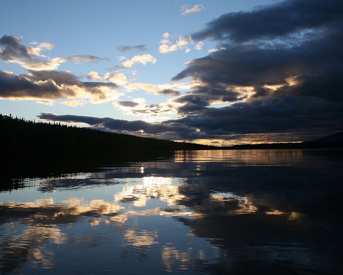 Lake reflection at sunset with dramatic clouds