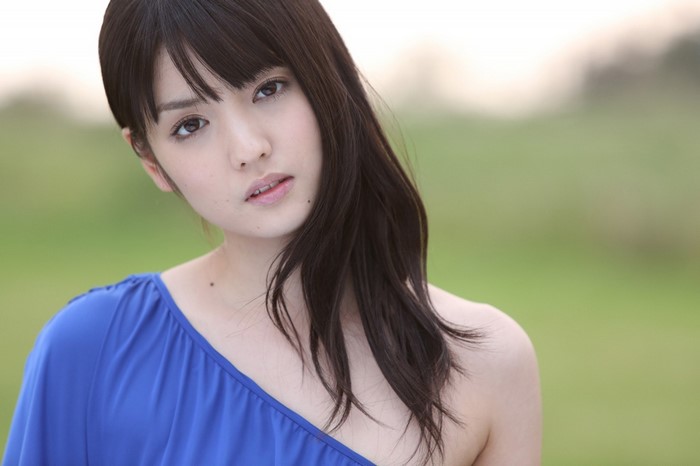 Portrait of a Woman with Long Black Hair in Blue Dress