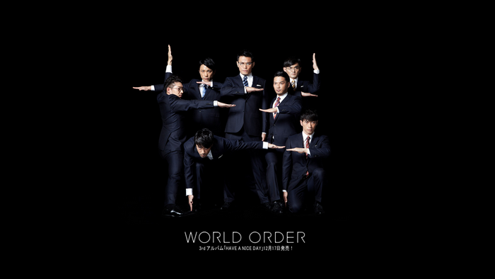 World Order group posing in suits