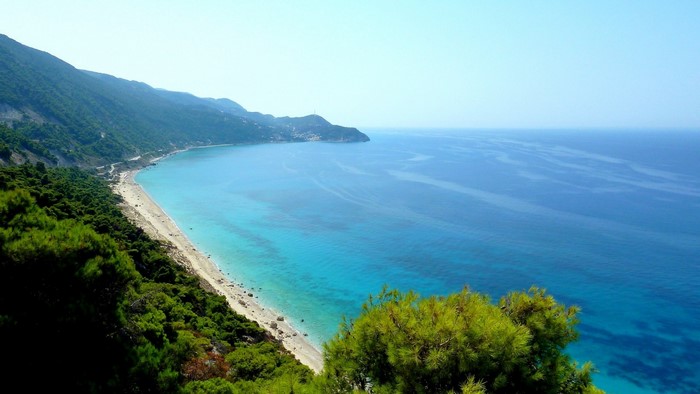 Coastal view of Lefkada with turquoise waters and green mountains