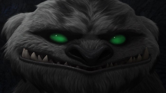 Furry creature with glowing green eyes and sharp teeth
