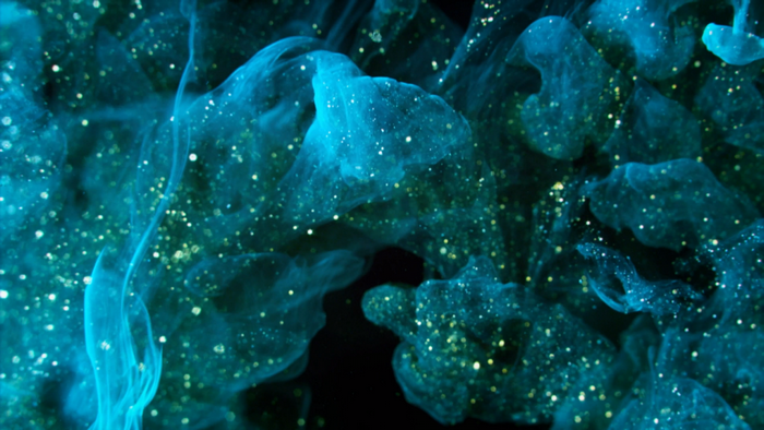 Abstract blue and turquoise smoke with glitter