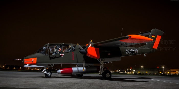 German OV-10B Bronco aircraft on tarmac at night