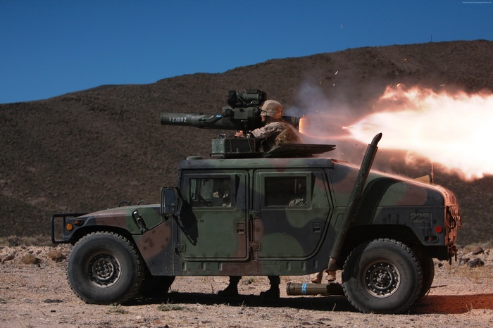 Soldier fires missile from HMMWV in desert
