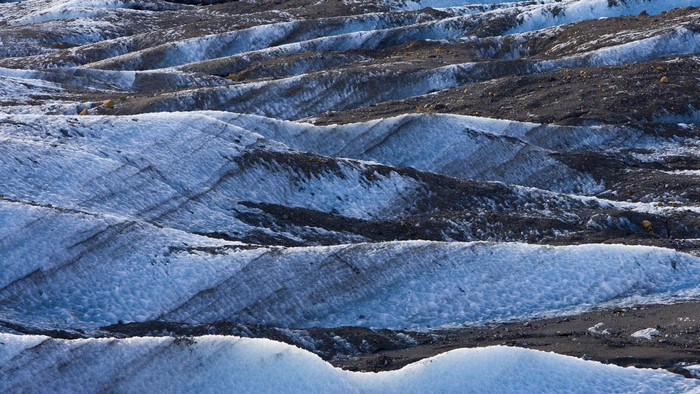 Glacier with dark moraine ridges in Iceland