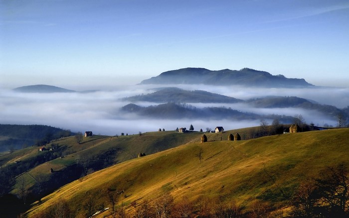 Morning Mist Over Rolling Hills and Mountain Ridge