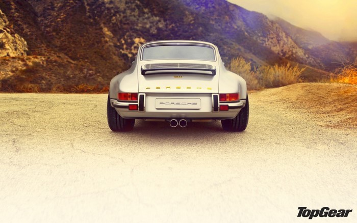 Rear view of a silver Porsche 911 sports car