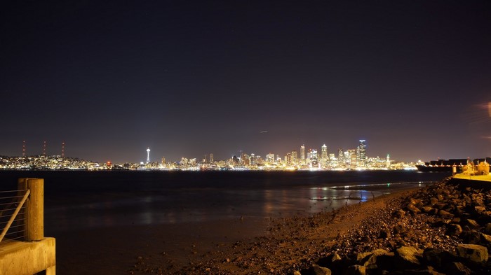 Seattle skyline at night with Space Needle and water