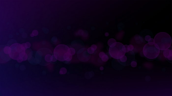Dark purple bokeh gradient with lens flare effect