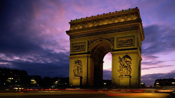 Arc de Triomphe at dusk with light trails