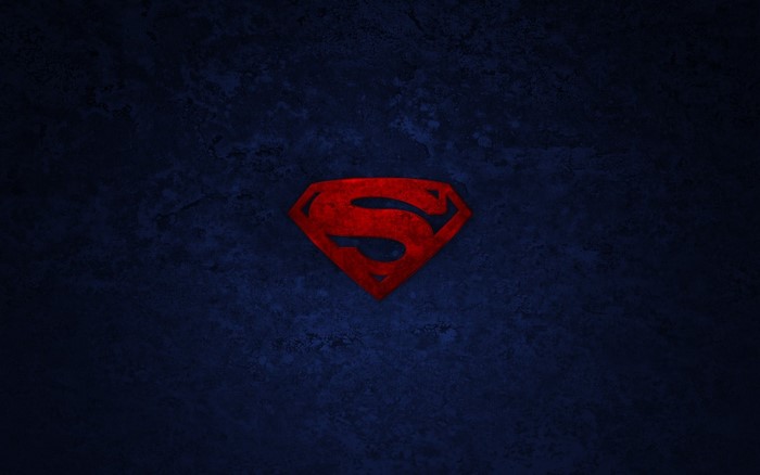 Superman logo on a dark blue background