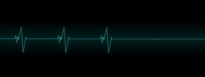 Minimalist electrocardiogram on black background