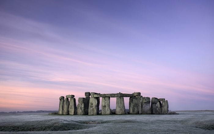 Stonehenge at sunrise with frost on the ground