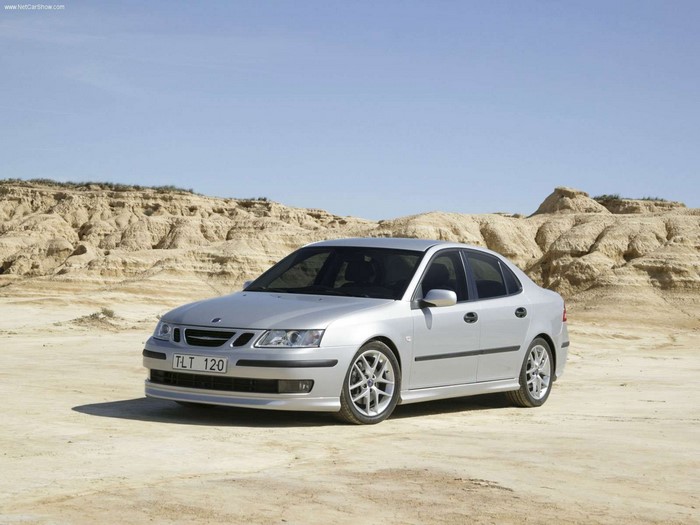 Silver Saab 9-3 Sedan parked in a desert landscape