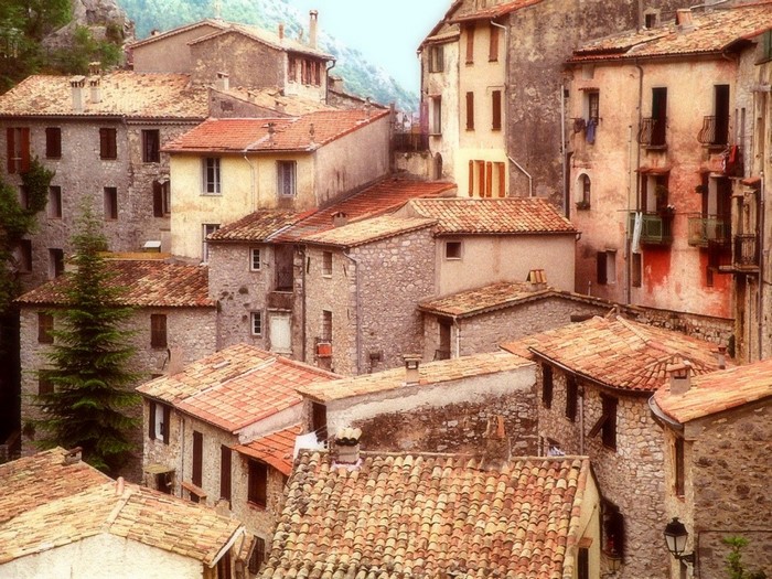 Old stone houses with terracotta rooftops in a village