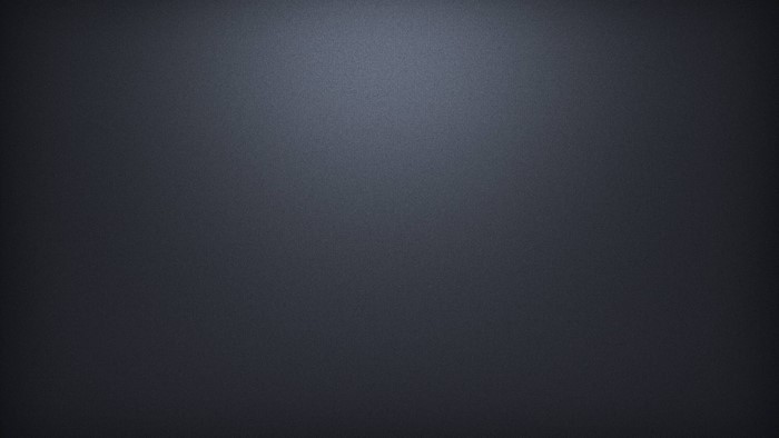 Dark textured surface with subtle lighting
