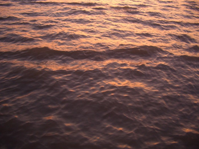 Sunset over rippling water