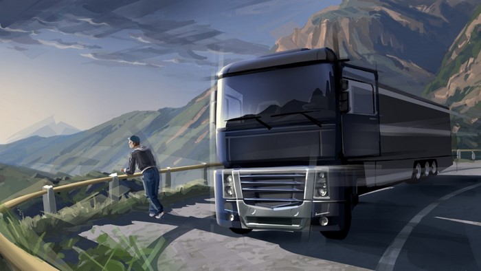 Man looking at mountains next to a truck