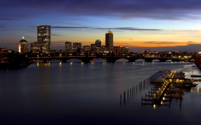 Boston cityscape at dusk with Charles River and bridge