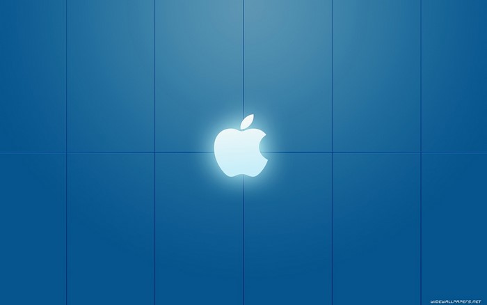 Glowing Apple logo on a blue grid background