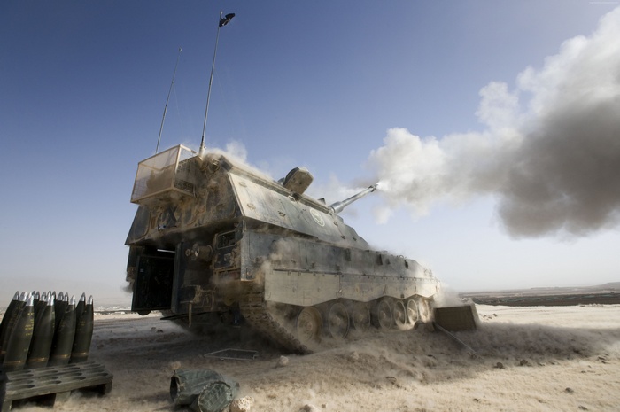 German PzH 2000 self-propelled howitzer firing in desert