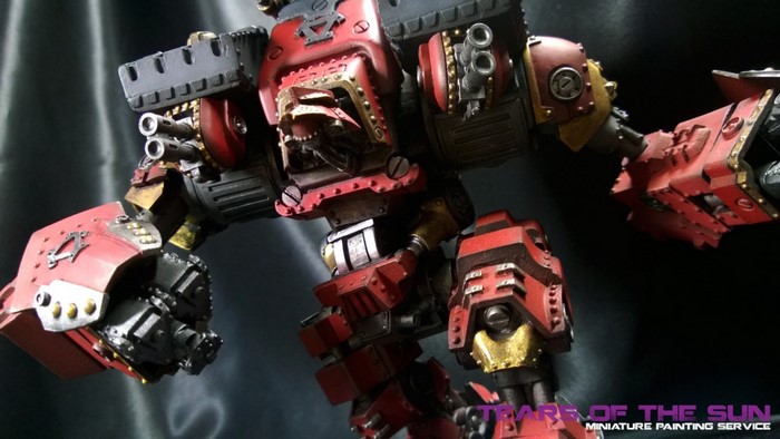 Red and gold war machine miniature