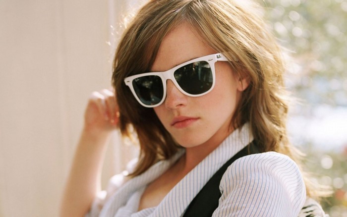 Emma Watson wearing white Ray-Ban sunglasses