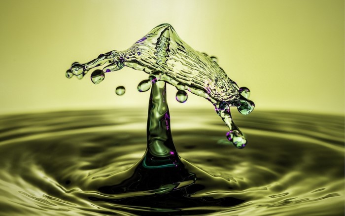 Macro photography of water splash with purple accents